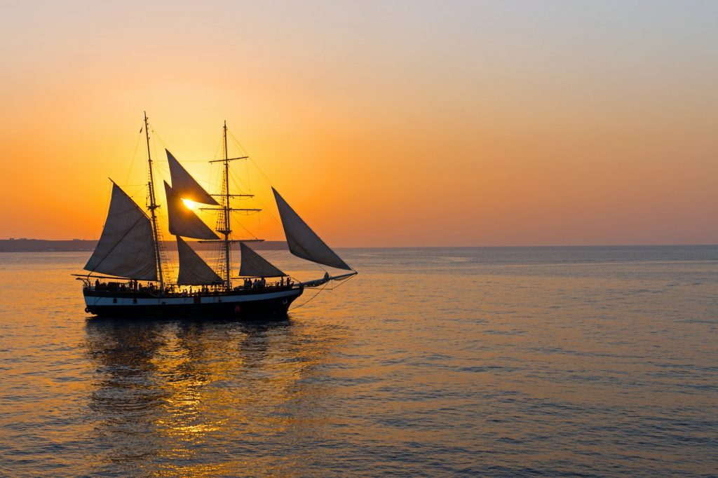 Romantic sunset with sailing ship